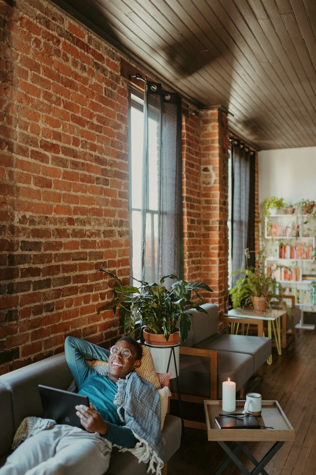 person reading news on tablet at home